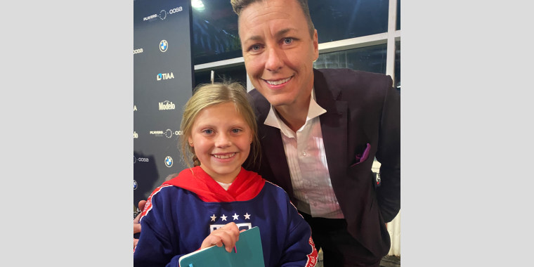 Abby Wambach poses with 9-year-old fan Addison Kuhl at the inaugural USWNT Player's Ball on Nov. 14, 2022, commemorating the Player's historical equal pay agreement.