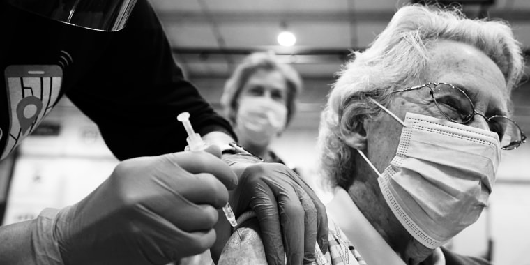 Image: A woman receives a Covid-19 vaccine in Martinsburg, W.V., on March 11, 2021.