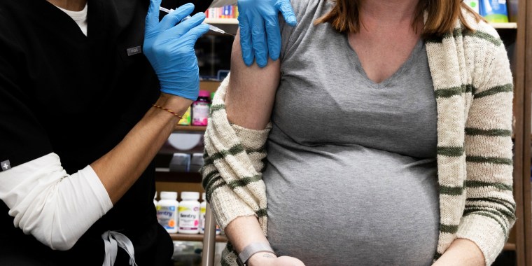 A pregnant woman receives a Covid-19 vaccination at Skippack Pharmacy in Schwenksville, Pa., on Feb. 11, 2021.