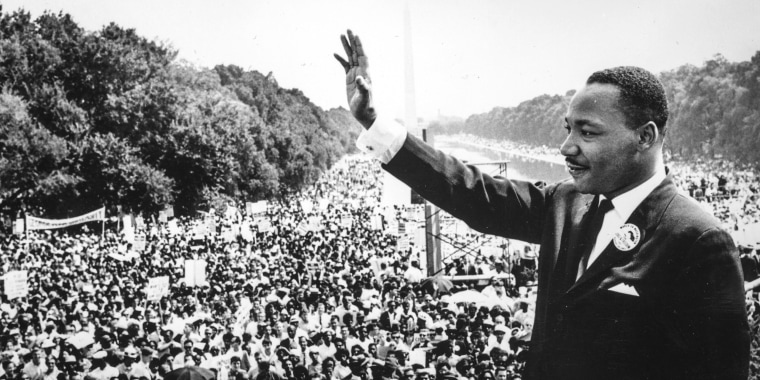 Martin Luther King Jr., waves to supporters on Aug. 28, 1963 on the Mall in Washington D.C. during the "March on Washington".