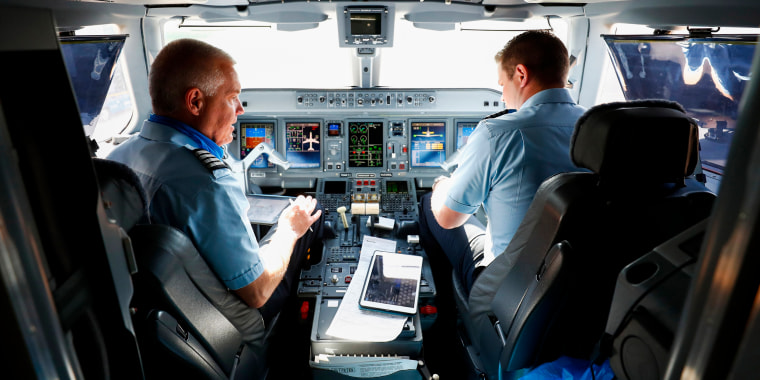 Breeze Airways pilots complete pre-flight checks before the airlines's inaugural flight at Tampa International Airport in Tampa, Fla., on May 27, 2021.