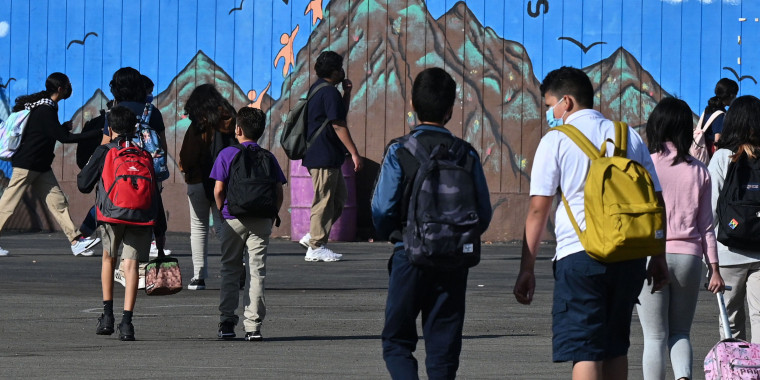 Students walk to their classrooms at a public middle school in Los Angeles on Sept. 10, 2021.