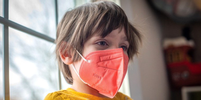 A child wears a KN95 protective mask