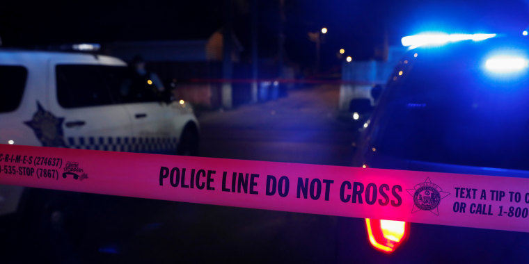 Chicago police crime scene tape marks the crime scene of a shooting of two men on Saturday evening at the South Side of Chicago