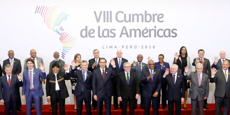 Dignitaries, prime ministers and heads of state wave during the group photo at the last Summit of the Americas in Lima, Peru, in 2018.
