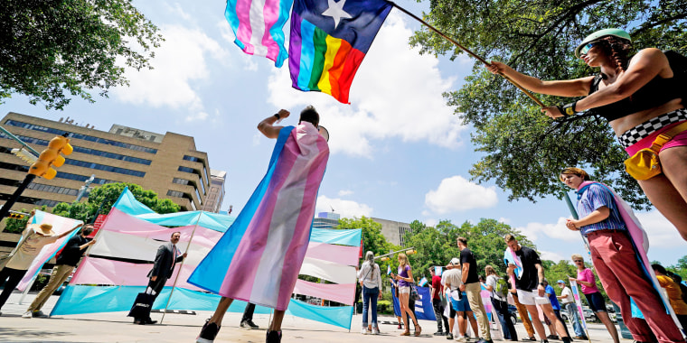 Demonstrators gather to speak against transgender-related legislation