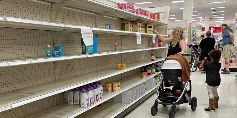 A woman shops for baby formula