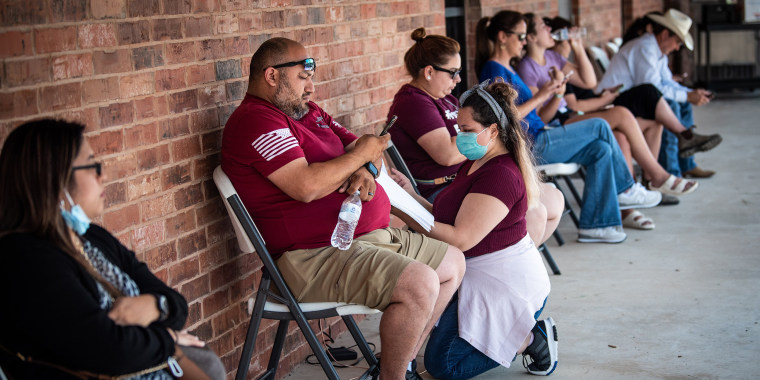 Image: People wait in line to donate blood at the Herby Ham Activity Center,  in Uvalde, Texas, on Wednesday, May 25, 2022, after Tuesday's shooting rampage at Robb Elementary School. (Christopher Lee/The New York Times)