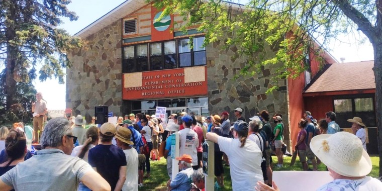 Local residents rally against the Greenidge bitcoin mining plant on June 5, 2021 at a Department of Environmental Conservation office in Avon, N.Y.