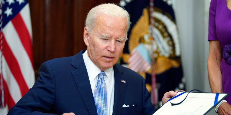 President Joe Biden signs into law S. 2938, the Bipartisan Safer Communities Act gun safety bill, in the Roosevelt Room of the White House in Washington, Saturday, June 25, 2022.