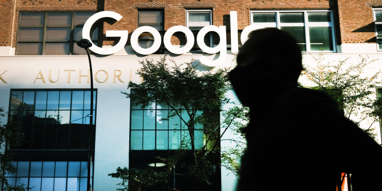 A person walks past Google's offices in New York