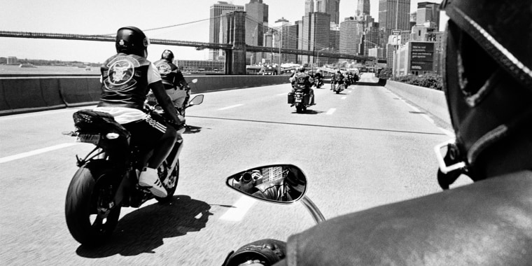 Members of a Black outlaw motorcycle club ride down the FDR Drive in New York. "Ezy Ryders," a photography book by Cate Dingley, documents New York's Black motorcycle clubs.