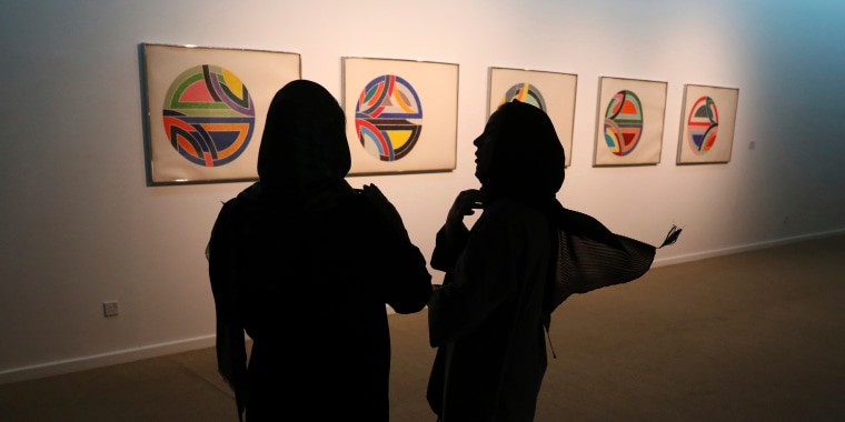 Two women visit a 19th and 20th-century American and European minimalist and conceptual masterpieces show at the Tehran Museum of Contemporary Art in Tehran, Iran, on Aug. 2, 2022.