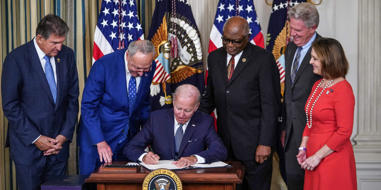 Image: President Joe Biden signs the Inflation Reduction Act of 2022 into law during a ceremony in the State Dining Room of the White House on Aug. 16, 2022.