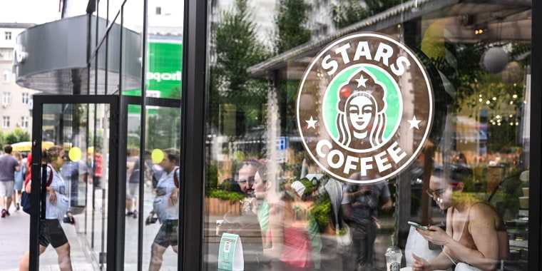 Image: People are seen inside the newly-opened Stars Coffee cafe in Moscow on Aug. 19, 2022.