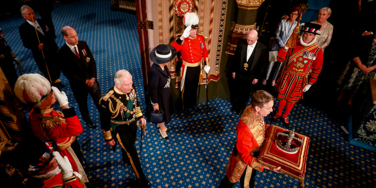 Image: King Charles III, Camilla, Queen Consort of the United Kingdom and Prince William of Wales proceed behind the Imperial State Crown during a ceremony for the State Opening of Parliament at the Palace of Westminster on May 10, 2022 in London.