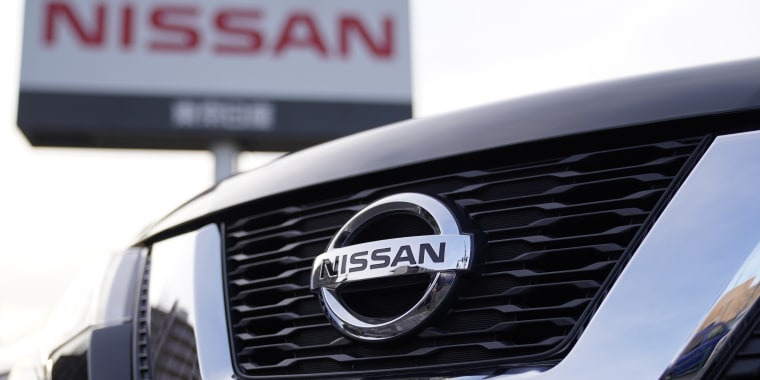 Close up of the Nissan logo on the front bumper of a car