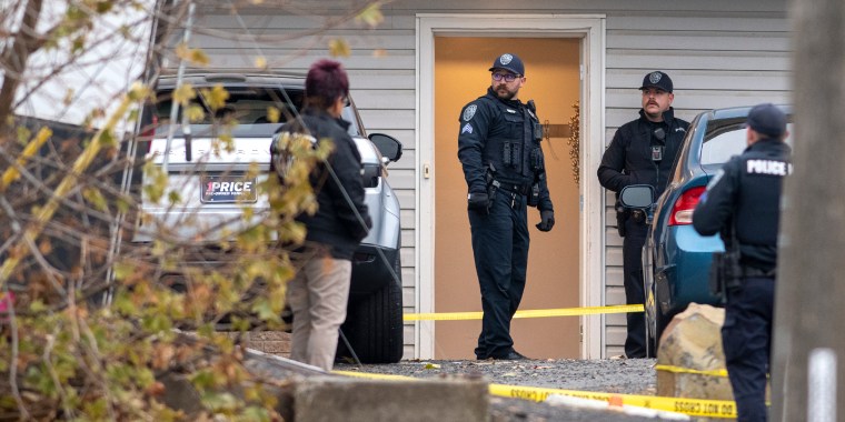 Officers investigate a homicide at an apartment complex south of the University of Idaho campus on Sunday, Nov. 13, 2022.