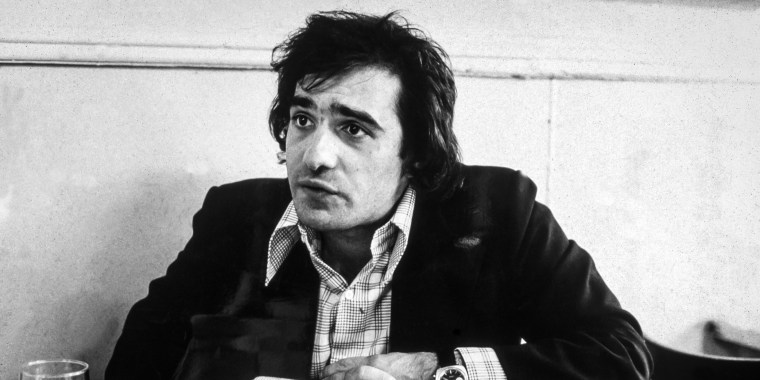 Martin Scorsese sits in a cafe on Mulberry Street in Little Italy, during the making of his film, 'Mean Streets,' New York City, October 1973