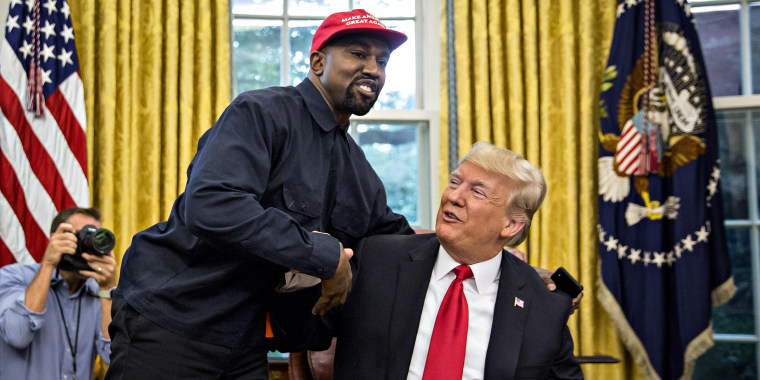 Rapper Kanye West, left, shakes hands with Then-President Donald Trump during a meeting in the Oval Office of the White House on Oct. 11, 2018.