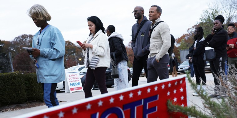 Residents wait in line to vote early outside a polling station in Atlanta