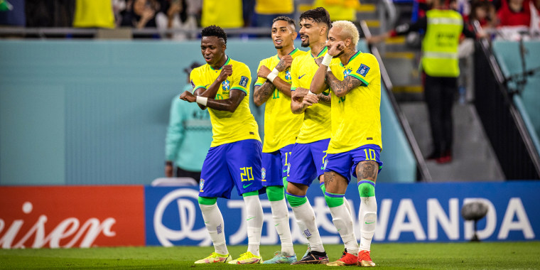 Neymar of Brazil dancing with Lucas Paqueta, Raphinha and Vinicius Junior of Brazil as he celebrates scoring a penalty during the FIFA World Cup Qatar 2022 Round of 16 match between Brazil and South Korea at Stadium 974 on Dec. 5, 2022 in Doha, Qatar.