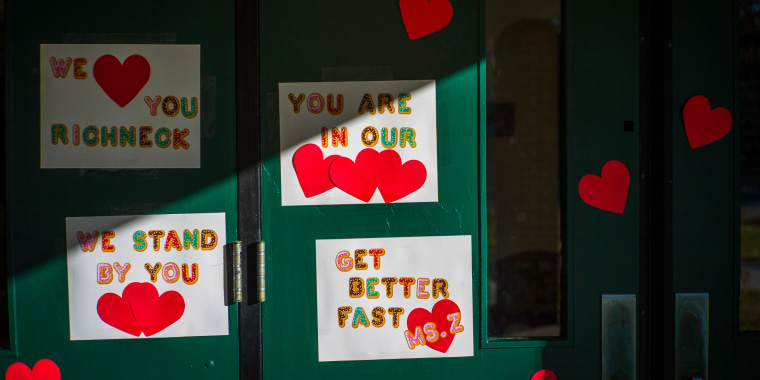 Messages of support for teacher Abby Zwerner grace the front door of Richneck Elementary School in Newport News, Va.