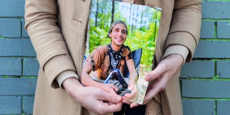 Vienna holds a photo of her slain partner, Tortuguita, in Atlanta on Jan. 26, 2023.