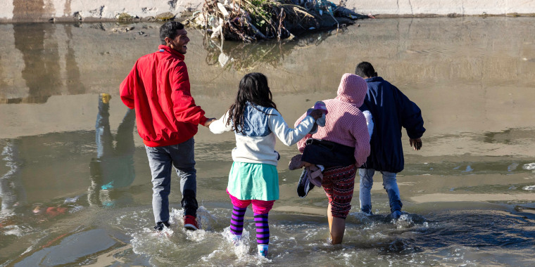 Immigrants cross the Rio Grande into El Paso, Texas from Ciudad Juarez, Mexico