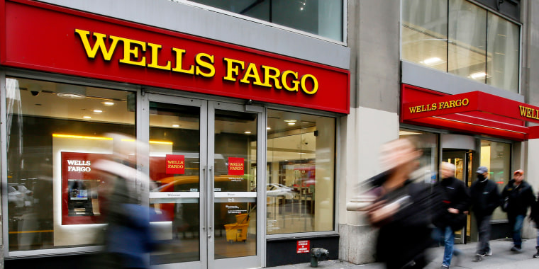 People walk past a Wells Fargo branch in New York