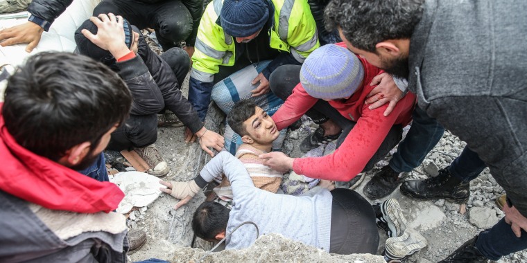 Mehmet Emin Ataoglu is rescued from under the rubble of 6 story building in Hatay, Turkey