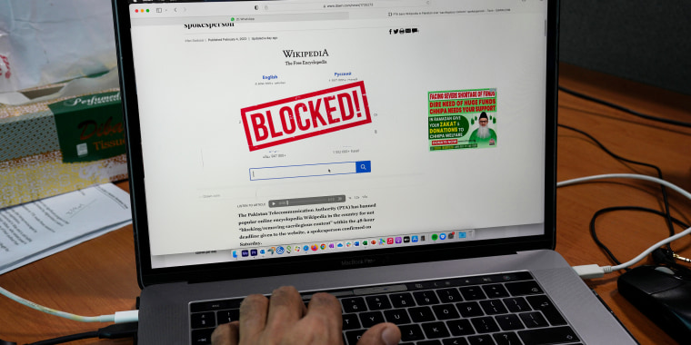 A computer screen displays a notice blocking the Wikipedia website through an online news site in Islamabad, Pakistan, on Feb. 6, 2023.