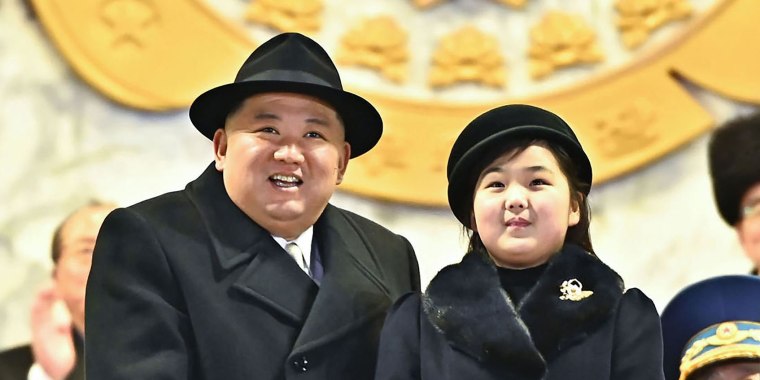 North Korea's leader Kim Jong Un and his daughter presumed to be named Ju Ae, attending a military parade in Pyongyang in images released Thursday. 