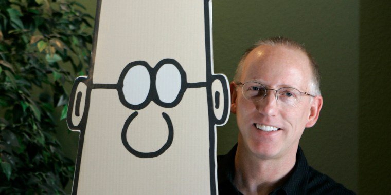 Scott Adams poses in 2006 with the Dilbert character from the comic strip he created.