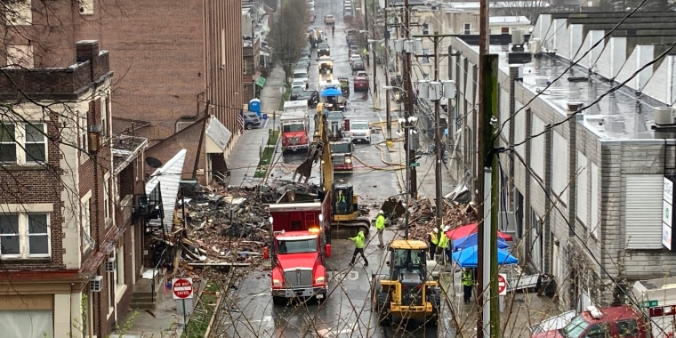 Emergency responders and heavy equipment are seen at the site of a deadly explosion at a chocolate factory Saturday  in West Reading, Pennsylvania.