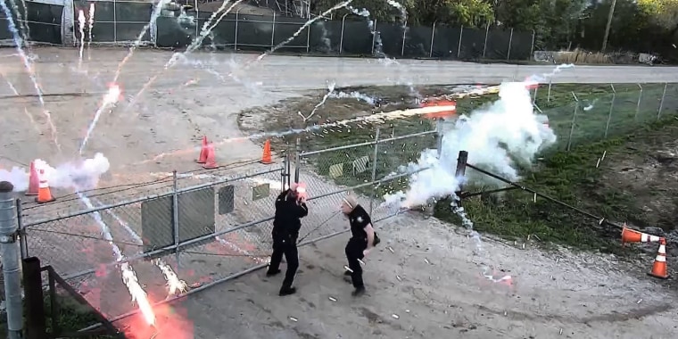 Protesters throw bricks at the site of police training center under construction in Atlanta on March 5, 2023.