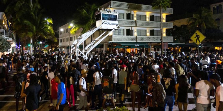 Crowds gather at Ocean Drive and 8th Street during spring break in Miami Beach, Florida, on Saturday, March 18, 2023.