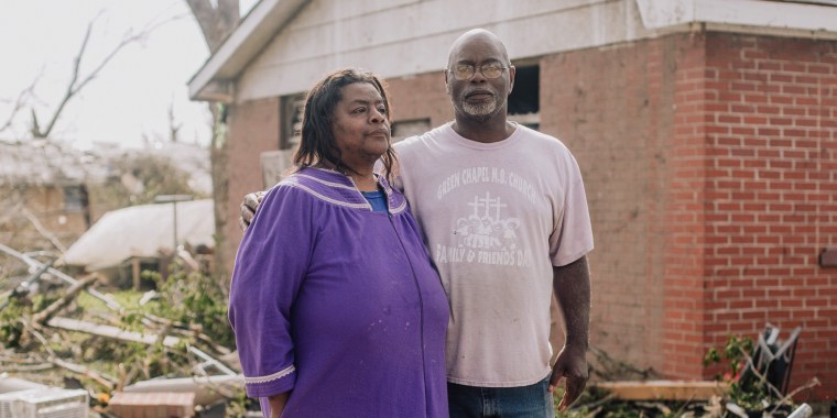 James Anderson and his sister Barbie stand in front of their home where they stayed during the tornado that ripped through Rolling Fork, Miss., two days earlier, on March 26, 2023.