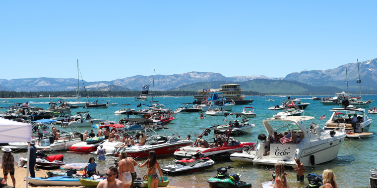 Boats sit in Lake Tahoe near hole 17 during a golf tournament on July 9, 2022. 