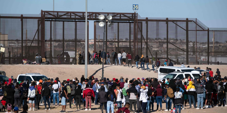 Migrants are processed by United States border patrol agents at the US-Mexico border in Ciudad Juarez, Mexico