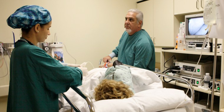 Dr. Pedro Jose Greer, right, prepares to do a colonoscopy at Mercy Hospital