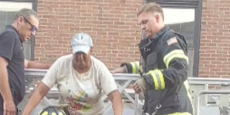 Lisa Brooks is rescued more than 24 hours after her apartment building in Davenport, Iowa, partially collapsed.
