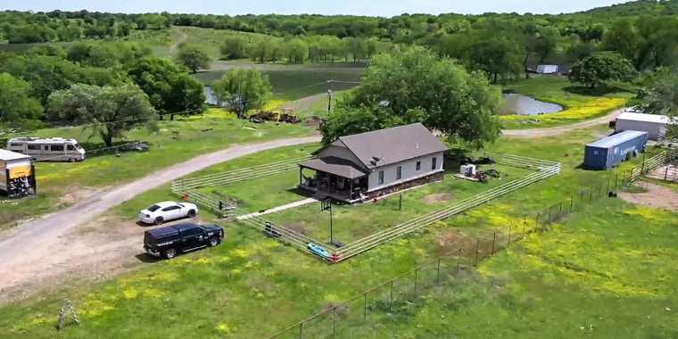 The crime scene where the bodies of seven people were found inside a home in Henryetta, Okla.