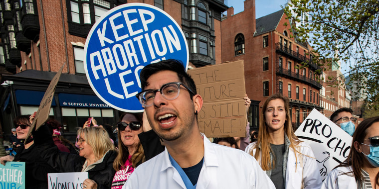 A group of doctors and medical workers join protesters gathering in front of the State House to show support and rally for abortion rights in Boston on May 3, 2022. 
