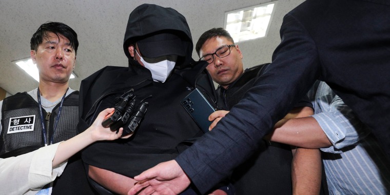 A man who opened an emergency exit door during a flight arrives to attend an arrest warrant review at the Daegu District Court in Daegu, South Korea, on May 28, 2023.