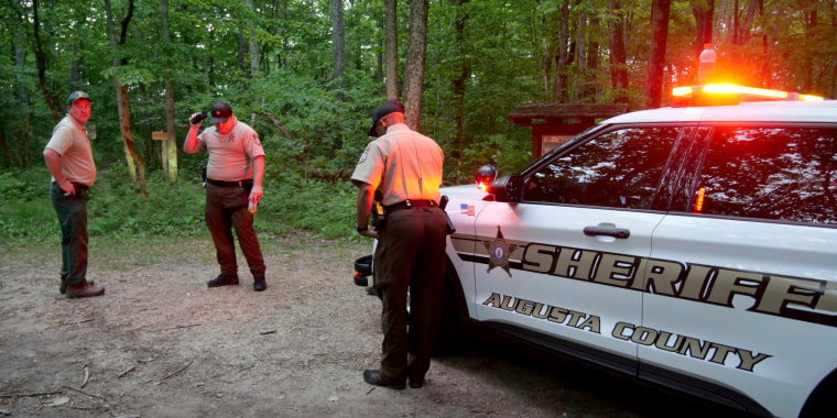 Authorities secure the entrance to Mine Bank Trail, an access point to the rescue operation along the Blue Ridge Parkway where a Cessna Citation crashed over mountainous terrain near Montebello, Va., on June 4, 2023. 