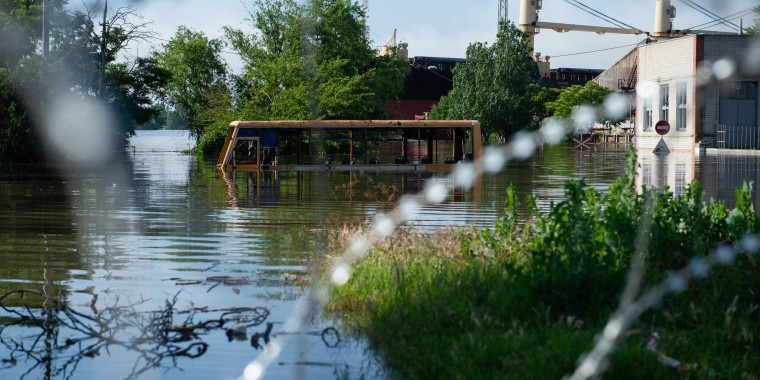 A bus submerged in floodwaters in Kherson after the bursting