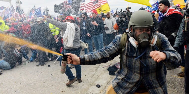 Rioters clash with police and security forces at the Capitol