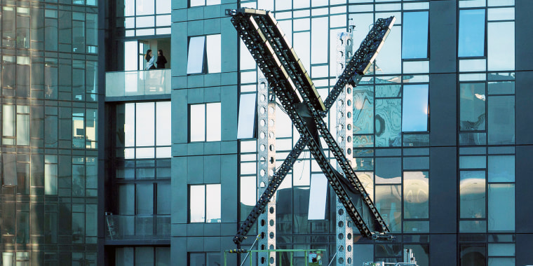 A partially completed "X" sign rests atop the company headquarters, formerly known as Twitter, in downtown San Francisco, on Friday, July 28, 2023. San Francisco has launched an investigation into the sign as city officials say replacing letters or symbols on buildings, or erecting a sign on top of one, requires a permit. (AP Photo/Noah Berger)