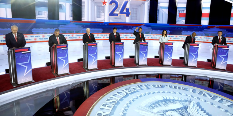 Image: Republican presidential candidates take the stage before the start of a primary debate hosted by Fox News in Milwaukee on Aug. 23, 2023.